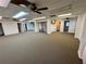Bright office space with neutral carpet, drop ceiling with ceiling fans and natural light at 24313 Pirate Harbor Blvd, Punta Gorda, FL 33955