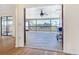 View of outdoor deck through double French doors at 24313 Pirate Harbor Blvd, Punta Gorda, FL 33955