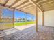 Covered patio with views of the waterfront canal and boat dock at 24313 Pirate Harbor Blvd, Punta Gorda, FL 33955