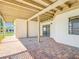 Covered outdoor patio providing a serene backyard view with a sliding door to the home at 24313 Pirate Harbor Blvd, Punta Gorda, FL 33955