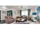 Cozy living room featuring comfortable seating and a coffee table at 301 Thorn Hill Pl, Sun City Center, FL 33573