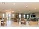 Community amenity room with dining tables, chairs, television, and comfortable seating areas at 7168 W Lenox Cir, Punta Gorda, FL 33950