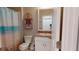 Charming bathroom with a beach-themed shower curtain and coordinated decor accents at 7168 W Lenox Cir, Punta Gorda, FL 33950
