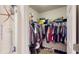 Organized walk-in closet filled with clothing, shoes, and storage solutions for optimal space utilization at 7168 W Lenox Cir, Punta Gorda, FL 33950