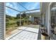 Spacious screened patio with tiled floor and outdoor furniture at 3300 Loveland Blvd # 1301, Punta Gorda, FL 33980