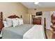 Main bedroom with wood flooring and a post bed at 3300 Loveland Blvd # 1301, Punta Gorda, FL 33980