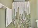 Bathroom with cactus themed shower curtain at 3300 Loveland Blvd # 1301, Punta Gorda, FL 33980