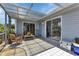Relaxing screened patio with tiled floor and seating area at 3300 Loveland Blvd # 1301, Punta Gorda, FL 33980