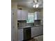 Newly remodeled kitchen with granite countertops and stainless steel appliances at 1286 Hillcrest Nw Ave, Port Charlotte, FL 33948