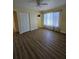 Spacious bedroom featuring wood-look floors and ample natural light at 1286 Hillcrest Nw Ave, Port Charlotte, FL 33948