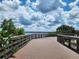 Relaxing boardwalk path offering scenic waterfront views at 1286 Hillcrest Nw Ave, Port Charlotte, FL 33948