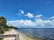 Relaxing beach view with calm water and sunny skies at 1286 Hillcrest Nw Ave, Port Charlotte, FL 33948