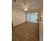 Bright dining area with wood-look floors and view to Gathering room at 1286 Hillcrest Nw Ave, Port Charlotte, FL 33948