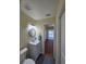 Simple bathroom with a toilet and vanity, offering functionality and style at 1286 Hillcrest Nw Ave, Port Charlotte, FL 33948