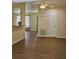 Casual dining area with wood-look floors and access to kitchen at 1286 Hillcrest Nw Ave, Port Charlotte, FL 33948