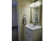 Clean bathroom with a vanity, mirror, and updated light fixture at 1286 Hillcrest Nw Ave, Port Charlotte, FL 33948
