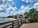 Scenic beach access with palm trees and calm water at 1286 Hillcrest Nw Ave, Port Charlotte, FL 33948