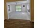 Bright Gathering room with tiled floors and sliding glass doors at 1286 Hillcrest Nw Ave, Port Charlotte, FL 33948