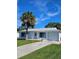 Cute one-story home with palm tree and driveway at 1286 Hillcrest Nw Ave, Port Charlotte, FL 33948