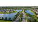 Aerial view of community entrance and lake at 7168 W Lenox Cir, Punta Gorda, FL 33950