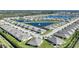 Aerial view of community with lake and many houses at 7168 W Lenox Cir, Punta Gorda, FL 33950