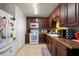 Kitchen with wood cabinets, granite counters, and white appliances at 265 Tipton St, Port Charlotte, FL 33954