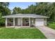 Charming one-story house with covered porch and attached garage at 265 Tipton St, Port Charlotte, FL 33954