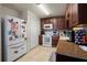 Kitchen with wood cabinets, granite counters, and white appliances at 265 Tipton St, Port Charlotte, FL 33954