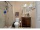 Bathroom with shower, toilet, and vanity with a granite top at 265 Tipton St, Port Charlotte, FL 33954