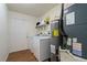 Laundry room with washer, dryer, and extra storage at 265 Tipton St, Port Charlotte, FL 33954