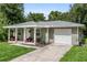 House exterior featuring a covered porch and a garage at 265 Tipton St, Port Charlotte, FL 33954