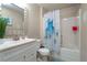 Clean bathroom with a tub shower, vanity, and white fixtures at 265 Tipton St, Port Charlotte, FL 33954