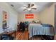 Bedroom with double bed, ceiling fan, and wood floors at 265 Tipton St, Port Charlotte, FL 33954