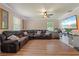 Spacious living room with L-shaped sectional sofa and hardwood floors at 265 Tipton St, Port Charlotte, FL 33954