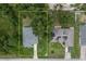 Aerial view showcasing a house and neighboring property with trees at 265 Tipton St, Port Charlotte, FL 33954
