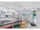 Eat-in kitchen with granite counters, stainless steel appliances, and pool view at 5001 Richmond Ter, North Port, FL 34287