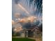 Single-Gathering home with American flag and a beautiful sunset at 5001 Richmond Ter, North Port, FL 34287