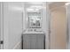 Modern bathroom with gray vanity and shower at 5001 Richmond Ter, North Port, FL 34287