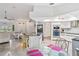 Modern kitchen with granite counters, stainless steel appliances, and breakfast bar at 5001 Richmond Ter, North Port, FL 34287