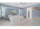 Bright bedroom with king-size bed, and access to private balcony at 5001 Richmond Ter, North Port, FL 34287