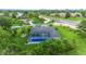 Single-Gathering home with pool and lush landscaping, offering a desirable location at 5001 Richmond Ter, North Port, FL 34287