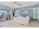 Bedroom with king bed, patio access, and built-in entertainment center at 5001 Richmond Ter, North Port, FL 34287