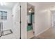 Hallway with laundry room and bedroom access at 5001 Richmond Ter, North Port, FL 34287
