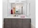 Modern bathroom with gray vanity and large mirror at 5001 Richmond Ter, North Port, FL 34287