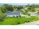 Single-Gathering home with a large grassy yard and mature landscaping at 5001 Richmond Ter, North Port, FL 34287