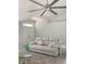 Living room with a light-colored sofa, ceiling fan, and double doors at 5001 Richmond Ter, North Port, FL 34287