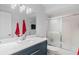 Bathroom with updated vanity and walk-in shower at 5001 Richmond Ter, North Port, FL 34287
