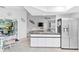 Modern kitchen with island, stainless steel appliances, and granite countertops at 5001 Richmond Ter, North Port, FL 34287