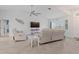 Relaxing living room with comfortable seating and a view to the kitchen at 5001 Richmond Ter, North Port, FL 34287
