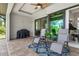 Patio with seating area and grill, adjacent to the pool at 14041 Clarissa Ln, Port Charlotte, FL 33981